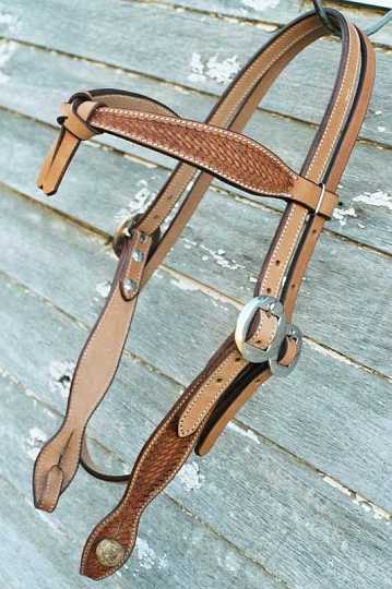 Cross brow Bkroo-1.jpg - Cross Brow Buckaroo bridle ~ Natural with black edge ~ Basket weave stamping & dressed with Stainless Steel Cart Buckles.
Rawhide button bit attachment.